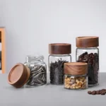 Glass food storage jar in Sri Lanka, premium quality thick glass jar in Colombo, airtight food container Sri Lanka, wooden screw-type lid jar, best kitchen storage jar Sri Lanka, pantry storage container Colombo, high-quality glass jar in Sri Lanka.