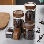 Glass food storage jar in Sri Lanka, premium quality thick glass jar in Colombo, airtight food container Sri Lanka, wooden screw-type lid jar, best kitchen storage jar Sri Lanka, pantry storage container Colombo, high-quality glass jar in Sri Lanka.